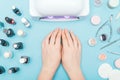 Composition for nail care, female young hands, French manicure, gel polish, lamp for nails and equipment for nail care. Flat lay p