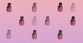 Composition of nail polish repeated on pink background