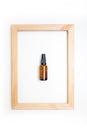 Composition natural cosmetics lotion and wooden frame white background top view Royalty Free Stock Photo