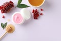 Composition with natural homemade mask, pomegranate and ingredients on white background