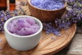 Composition with natural sugar scrub and lavender flowers on table. Cosmetic products