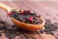 Composition of natural tea with a leaves of rose. Macro photo of