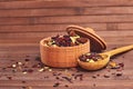 Composition of natural tea with a leaves of rose. Macro photo of tea petals in a wooden board. Tea with petals of Sudanese rose, b Royalty Free Stock Photo