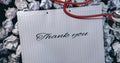 Composition of notebook with thank you note, with scrunched up paper and stethoscope on desk Royalty Free Stock Photo