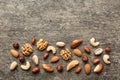 Composition of nuts , flat lay - mix hazelnuts, cashews, almonds on table background. healthy eating concepts and food Royalty Free Stock Photo