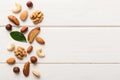 Composition of nuts , flat lay - mix hazelnuts, cashews, almonds on table background. healthy eating concepts and food Royalty Free Stock Photo