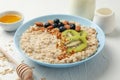 Composition oatmeal with fruits on white background