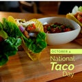 Composition of october 4 national taco day text over tacos Royalty Free Stock Photo