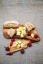 Composition with olive wood, olives, bread, cheese pieces in olive oil, spices Royalty Free Stock Photo