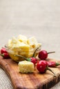 Composition with olive wood, olives, cheese pieces in olive oil, bread and spices Royalty Free Stock Photo