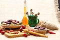 Composition with olive wood, olives, cheese pieces in olive oil, bread and spices Royalty Free Stock Photo