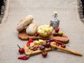 Composition with olive wood, olives, cheese pieces in olive oil, spices Royalty Free Stock Photo