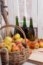 Organic fresh apples with bottle of Normandy cider
