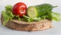 The composition of organically grown vegetables cucumbers, tomatoes, lettuce Royalty Free Stock Photo