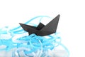 Composition with origami boat and paper ribbons on white background