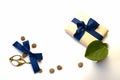 A composition of packaged gifts, Kraft paper and blue ribbon isolated on a white background. The view from the top. For mockup, in