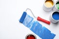 Composition with paint cans and roller brush on white Royalty Free Stock Photo