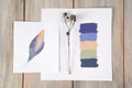Composition of a palette, a dry natural plant and a drawing. Composition for your design Royalty Free Stock Photo