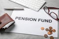 Composition of paper with words PENSION FUND, glasses and money Royalty Free Stock Photo
