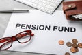Composition of paper with words PENSION FUND, glasses and money Royalty Free Stock Photo