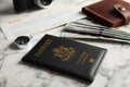 Composition with passport, compass and money on marble table. Royalty Free Stock Photo