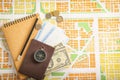 Composition with passport, money and immigration bureau cards on city map. Travel planning concept Royalty Free Stock Photo