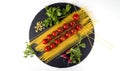 Composition of pasta fresh tomato, pepper, radish on black stone board, white background. Royalty Free Stock Photo