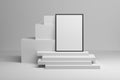 Composition with A4 photo frame on a stack of white cubes panels Royalty Free Stock Photo