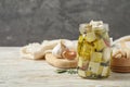 Composition with pickled feta cheese in jar on wooden table, space for text Royalty Free Stock Photo