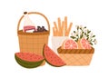 Composition of picnic baskets with delicious meals and snacks for outdoor romantic dinner bottle of wine, breadsticks