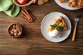 Composition with piece of delicious apple pie and ice cream on wooden background Royalty Free Stock Photo