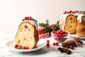 Composition with piece of traditional homemade Christmas cake on white marble table, closeup Royalty Free Stock Photo