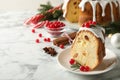 Composition with piece of traditional homemade Christmas cake on white marble table, closeup. Space for text Royalty Free Stock Photo