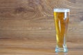 composition of pilsner glass with delicious clear beer o