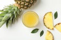 Composition with pineapple, slices and glass of juice on white background Royalty Free Stock Photo