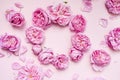 Composition of pink flowers on a pink background. Top view. Flat lay. Festive background. Place for text. Postcard template.