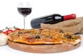 Composition with a pizza, a glass and a bottle of wine