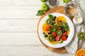 Composition with plate of fresh fruit salad on wooden table, top view Royalty Free Stock Photo