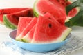 Composition with plate fresh watermelon on white wooden background Royalty Free Stock Photo