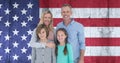 Composition of portrait of smiling caucasian couple with son and daughter against american flag Royalty Free Stock Photo