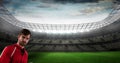 Composition of portrait of sportsman over pitch in sports stadium with cloudy sky
