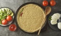 Composition with raw dought and fresh ingredients for pizza isolated on dark background. Copy space. Banner image for social media Royalty Free Stock Photo