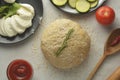 Composition with raw dought and fresh ingredients for pizza isolated on white background. Copy space. Flat lay food ingredients Royalty Free Stock Photo