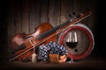 Composition with red grape, wine, violin and barrel Royalty Free Stock Photo