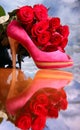 Composition with red roses and pink female shoe Royalty Free Stock Photo
