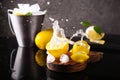 Composition with ripe lemons and splashes on wooden board Royalty Free Stock Photo