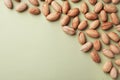 Composition with ripe pecan nuts on color background, flat lay
