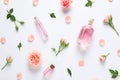 Composition with rose essential oil and flowers, top view Royalty Free Stock Photo