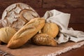 Composition of rustic bread on wooden table