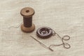 Sewing thread and for knitting? the gray thread and the needle and the button Royalty Free Stock Photo
